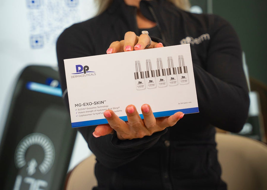 Woman holding a product box with 'Dp dermaceuticals' branding in front of a blurred background with text and logos.