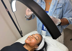 Load image into Gallery viewer, Person receiving a facial treatment with a professional setup.